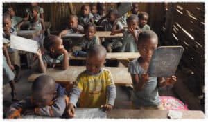 Students practice letters in a classroom in Togo