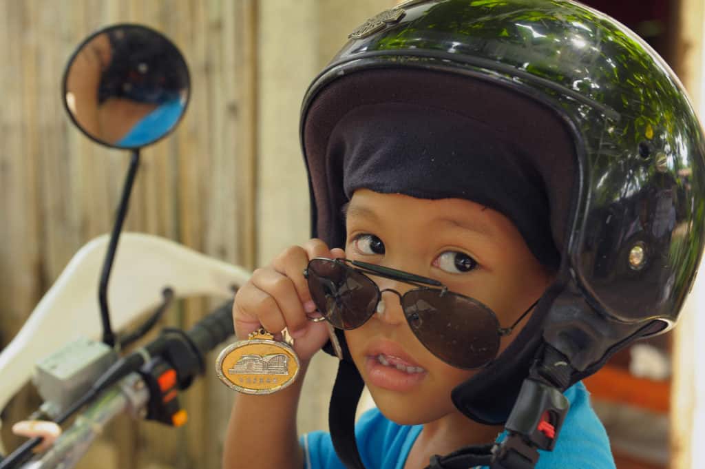 This boy in the Philippines is all dressed up for a motorcycle ride. In countries where Compassion works, it’s common to see kids riding on the backs of motorcycles — sometimes with several other people.