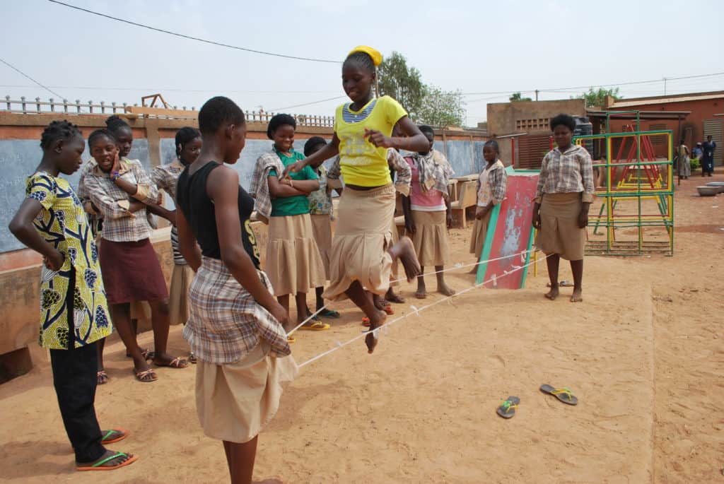 Group of young people jumping or skipping rope